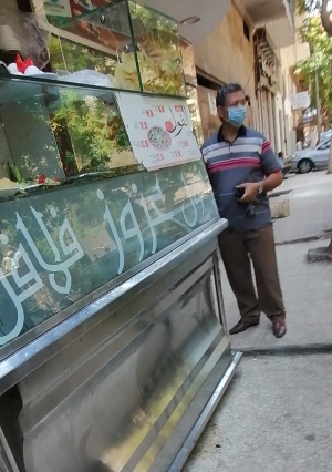 عوده العمل و ارتداء الكمامات فى الشوارع تصوير عدنان عماد