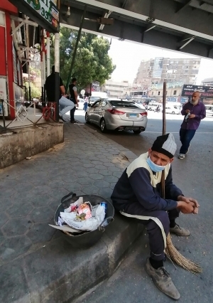 عوده العمل و ارتداء الكمامات فى الشوارع تصوير عدنان عماد