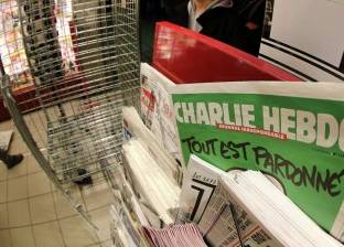"شارلي إيبدو" تتقدم بشكوى إثر تهديدات بالقتل بعد كاريكاتير طارق رمضان