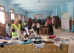 ملتقى المصريين بالكويت: توزيع 1200 قطعة ملابس على الأسر المستحقة في الجيزة
