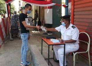 الأمن يوزع كمامات وقفازات مجانية على الناخبين في الشرابية