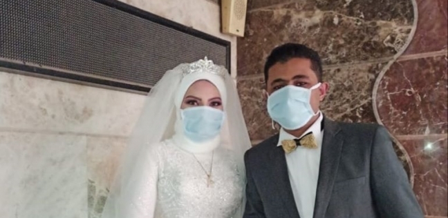 العروسان محمد ونورهان خلال زفافهما