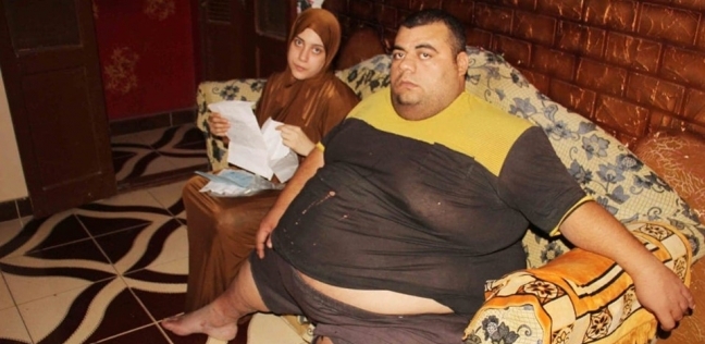 "محمود سمير" مريض السمنة المفرطة وزوجته