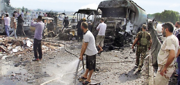 آثار التفجيرات الدامية التى شهدتها سوريا أمس «أ.ف.ب»