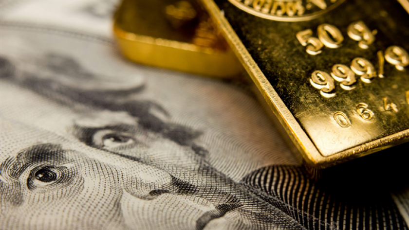 الذهب والدولار الأمريكي- صورة تعبيرية