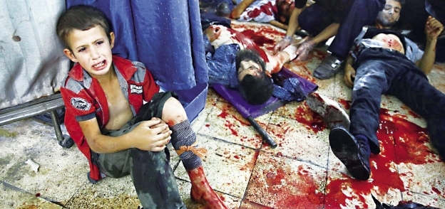 دماء ضحايا سقوط قذائف فى اللاذقية بسوريا أمس