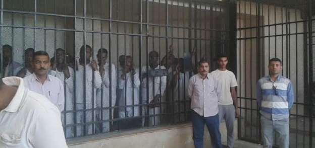 المتهمين بقضية"مذبحة أسوان" بمجمع محاكم أسيوط