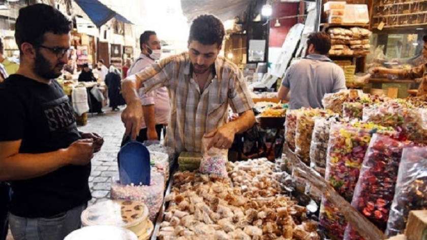بيع الحلوى في شوارع سوريا خلال عيد الفطر - أرشيفية