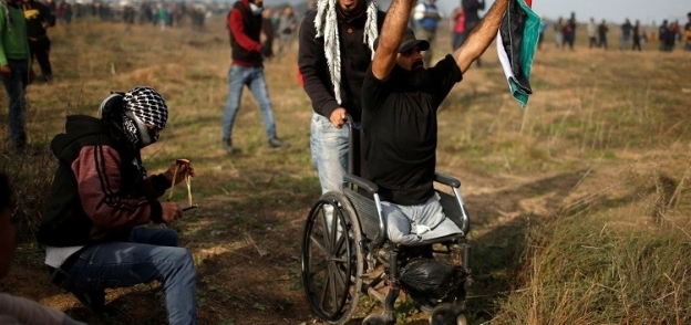 بالصور| حياة شهيد غزة القعيد على لسان جاره: تحدى الاحتلال بـ"نصف جسد"