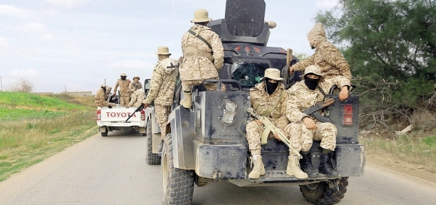أفراد من قوات حماية طرابلس يقومون بدوريات بمناطق جنوب العاصمة «أ.ف.ب»