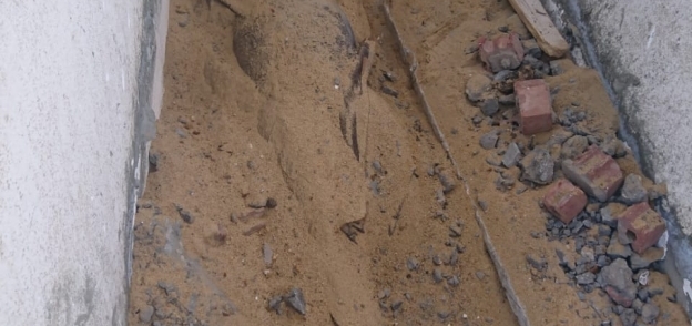 صور العقار والمقبرة الأسمنتية فى واقعة قتل مهندس ديكور ببولاق الدكرور