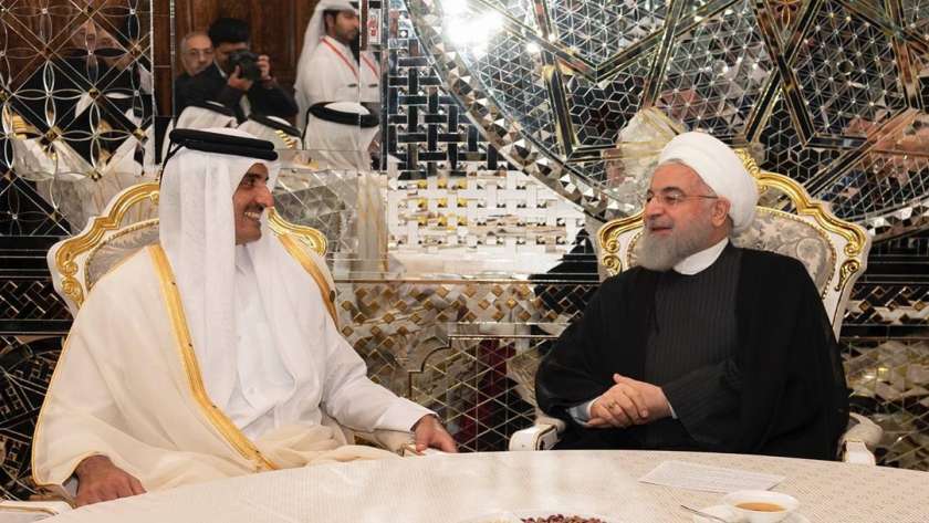 الرئيس الإيراني مع أمير قطر