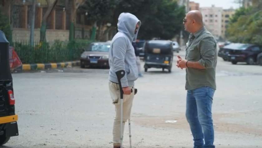 سائق التوكتوك مع الإعلامي أيمن مصطفى