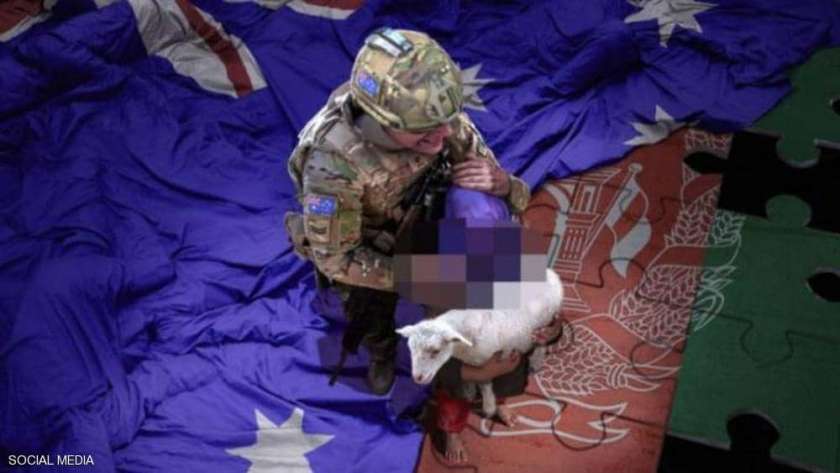 صورة الجندي الأسترالي والطفل الأفغاني فجرت أزمة دبلوماسية