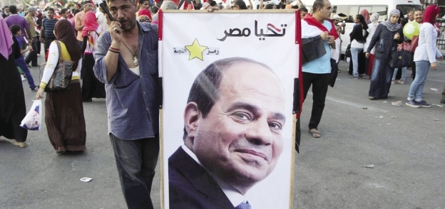 احتفالات المصريين بـ«قناة السويس» وتأييداً لـ«السيسى» «أ.ف.ب»