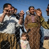 عراقيون بعد وصولهم إلى مخيمات اللاجئين