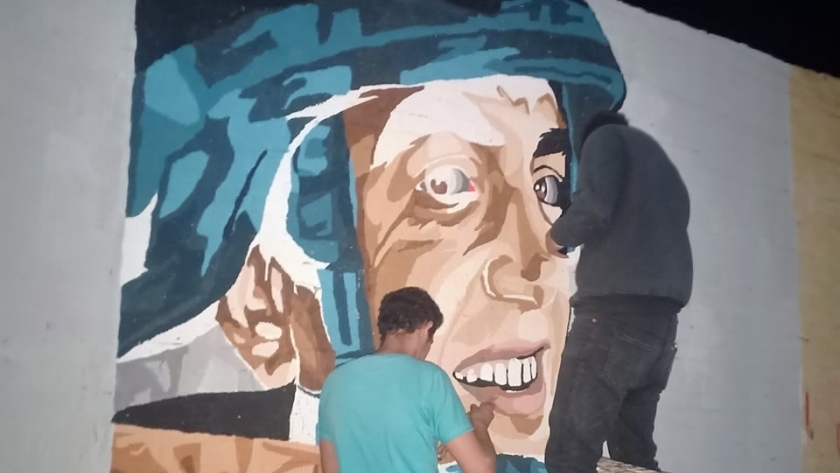 لوحة تذكارية للشهيد "المنسي " بشوارع المحلة لمواجهه الإرهاب والتطرف