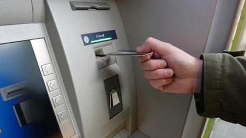 ماكينة ATM- الشمول المالي