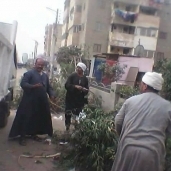 صورة حملة نظافة بشوارع بندر طامية بالفيوم