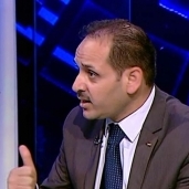 الدكتور أسامة شعث، أستاذ العلاقات الدولية