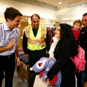 رئيس الوزراء الكندي يستقبل اللاجئين