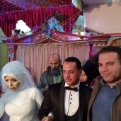 بالصور..بالبدلة والفستان:عروسان يجريان التحاليل الطبية بحملة ١٠٠مليون صحة فى كفر الشيخ