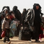 أسرة سورية أثناء هروبها من معارك فى «باغوز»