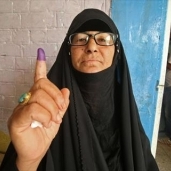 سيدة عراقية بعد الإدلاء بصوتها