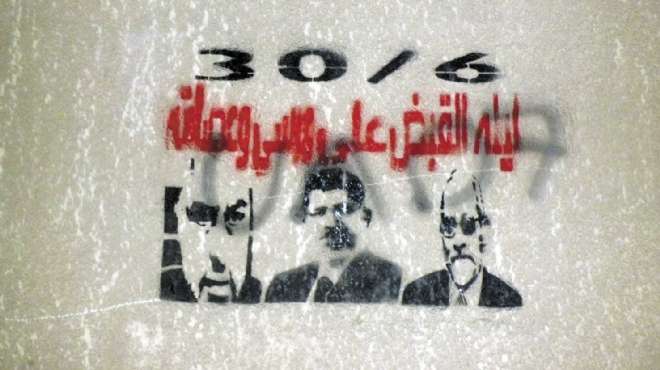 «ليلة القبض على مرسى».. جدارية تتحدى أنصار الرئيس فى مدينة نصر