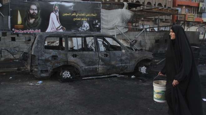  مقتل 51 شخصا في انفجار سيارات ملغومة ببغداد