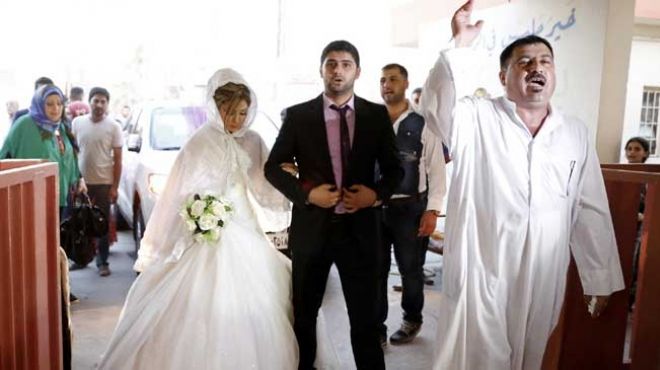 بالصور| حفل زفاف يوحد بين السنة والشيعة في العراق 