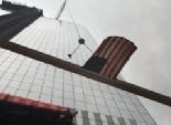  تركيب القمة المستدقة لأول أبراج مركز التجارة العالمي الجديد بنيويورك 
