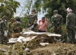 بالصور| البحث عن جثث الضحايا بعد تحطم طائرة في لاوس