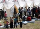 لاجئون سوريون وعراقيون يحتجون في مخيم بجزيرة يونانية