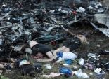  بالصور| جثث ضحايا الطائرة الماليزية المنكوبة تغزو قرية 