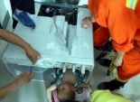  بالصور| فريق إنقاذ يحاول انتشال طفل صيني من داخل 