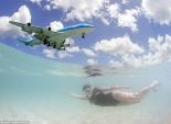 بالصور| الطائرات تحلق فوق رؤوس رواد أحد شواطئ البحر الكاريبي