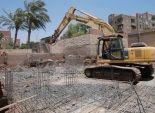 بالصور| إزالة أعمال بناء لشخص تعدى على مقابر المسلمين بأسيوط